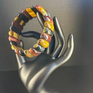 Polished exotic stones bring an earthy connection to this bracelet